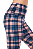 Plaid patterned leggings in navy, blue, and peach tones with high waist design, shown on lower body of person wearing them