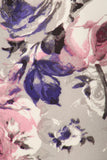 Vibrant floral print fabric with purple, pink, and white flowers on a light gray background, ideal for stylish yoga leggings