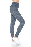 Woman wearing 5-inch long yoga-style leggings with high waist and multi-print design. Leggings feature a textured denim-like pattern in blue-gray color. Model is shown from waist to feet, paired with white sneakers.