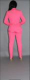 Vibrant pink powersuit with rhinestone letterings on blazer, paired with matching pants. Figure-hugging silhouette shown from back view, styled with nude heels for a confident and glamorous look.