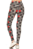 High-waisted yoga leggings with black, white, and red puzzle print pattern, showcasing a form-fitting design and full-length coverage, displayed on a mannequin lower body against a white background.