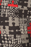 Close-up of puzzle-patterned fabric featuring interlocking pieces in various shades of black, white, and gray with occasional red accents, creating a unique and visually engaging design for yoga leggings.