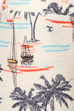 Tropical beach scene with sailboats, palm trees, and blue water, featuring a sailor-inspired print design on light fabric for yoga leggings