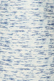 Close-up of white and blue marbled fabric texture, showcasing the unique multi-printed knit pattern of yoga-style leggings. Horizontal streaks of blue on a white background create a stylish, dynamic design perfect for activewear.